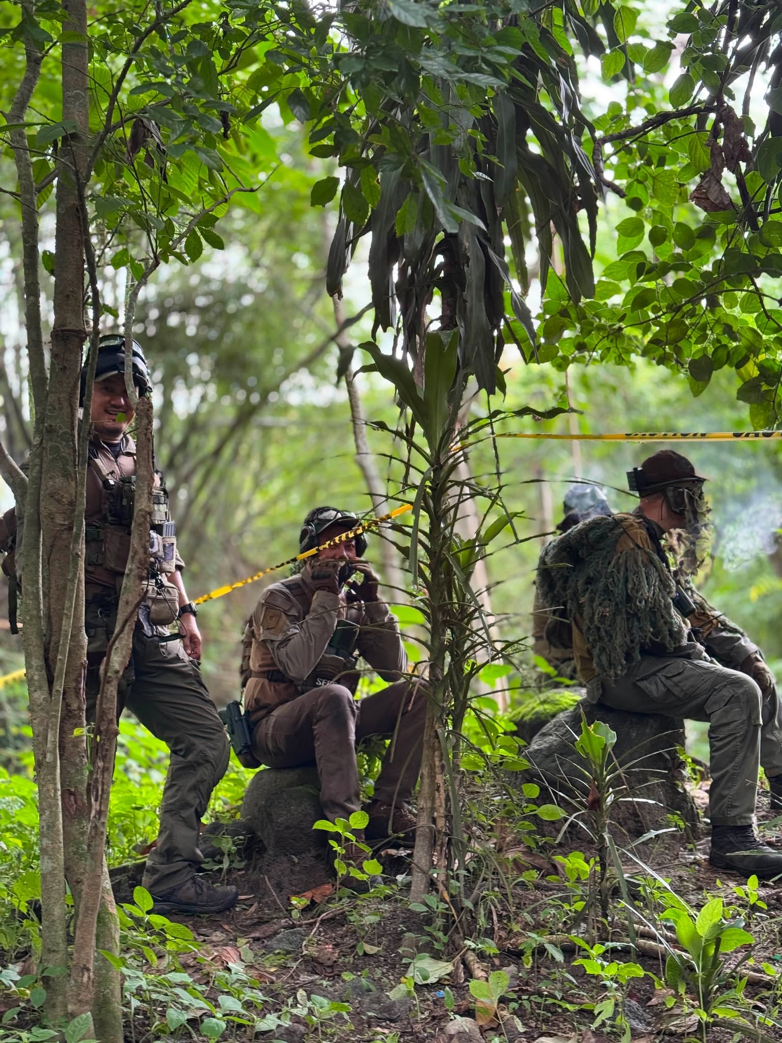 Team members assembled in dense jungle terrain during a recent airsoft operation